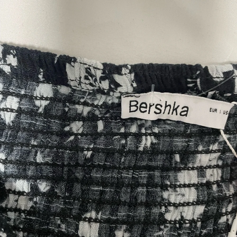 NWT Bershka shirred mini rara skort in black floral. Size Large